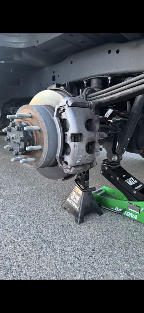 Ford F-250 brake service in progress.Front and rear brake pad replacement done with proper safety and attention to quality. - auto brake services