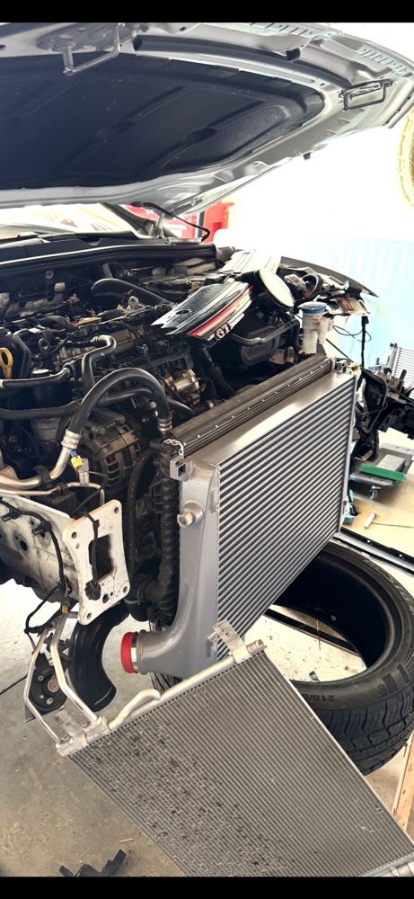 2024 Volkswagen Golf GTI -- upgraded performance turbo intercooler installation.