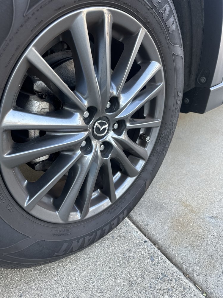 Mazda CX-5 -- wheel and brake inspection during mobile service.