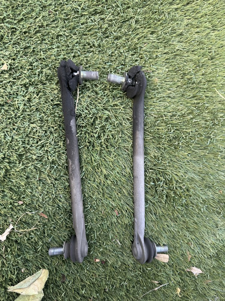 Worn stabilizer (sway bar) links removed and replaced with new parts.