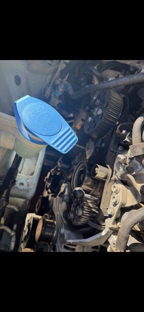 Timing belt and water pump replacement in progress on a turbo diesel engine. Experienced service performed on-site. - diesel engine repair