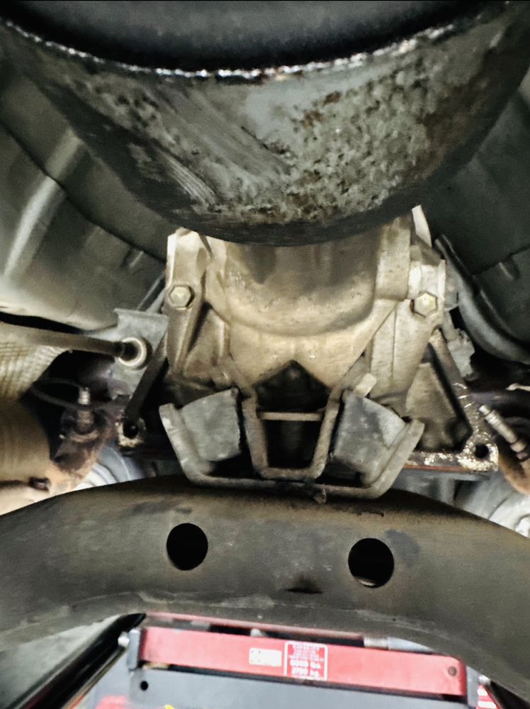 Diagnosis and replacement of the transmission mount. The automatic transmission mount was found torn and required replacement. - transmission