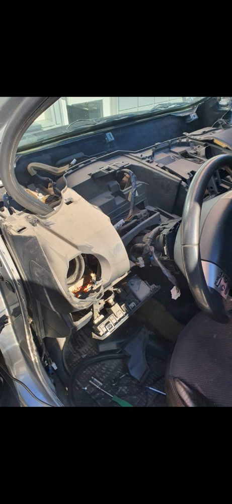 Interior disassembly process -- careful, professional, and damage-free work to access and repair components properly.